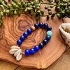 Blue Beaded Stretch Bracelet w/ Cowrie Shell & Copper Accents