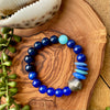 Shades of Blue Beaded Stretch Bracelet w/ African Silver Accent